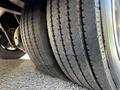 Close-up of three worn tires from a 2000 Ford Motorhome showing tread wear and details of the rubber surface