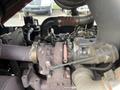 Close-up view of the engine components of a 2012 Toro Groundsmaster 5910 showing the turbocharger and surrounding machinery