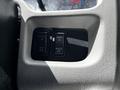 Two switch buttons labeled "STEP LIGHT" and "BEACON LIGHT" in a textured gray panel of a 2017 International WorkStar 7600 vehicle interior