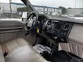 Interior view of a 2008 Ford F-450 SD showing the dashboard with controls and a tan cloth seat