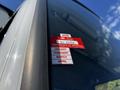 A 2021 Hino 338 truck with visible approval certificates displayed on the driver's side window