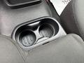 A cup holder in a 2011 Ford Ranger with two compartments for drinks