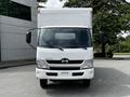 A 2018 Hino 195 box truck with a white exterior and large cargo area is shown from the front with visible headlights and side mirrors