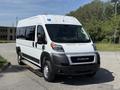 A 2021 RAM Promaster van with a white exterior and a black front bumper parked on a roadway