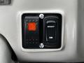 Control panel featuring a red indicator light and two switches labeled Bright and Dim