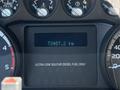 The dashboard of a 2014 Ford F-250 SD showing the odometer reading 73407.2 km and fuel type indicating ultra low sulfur diesel fuel only