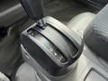 A close-up view of the gear shift lever of a 2020 Hino 195 showing the positions for reverse neutral and drive