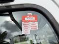 A 2017 Hino 338 truck with a red and white certificate of approval sticker displayed on the window showing the year and months of validity