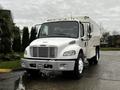 A white 2007 Freightliner M2 106 truck with a flat front and large windshield featuring a winch mounted on the bumper and multiple lights on the cab roof