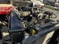 The image shows the engine compartment of a 2022 Blue Bird Vision with various components including hoses belts and a radiator
