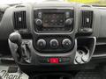 Dashboard of a 2021 RAM Promaster featuring a touchscreen display climate controls and gear shift lever