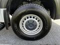 Close-up of the wheel of a 2017 Mercedes-Benz Sprinter featuring a silver rim and a Toyo Open Country tire