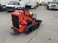 A red and black 2024 AGT Industrial LRT23 compact trenching machine with tracks and various control features prominently displayed in the foreground