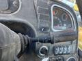 Close-up of the controls of a 2013 JCB 510-56 Loadall including a joystick and various buttons and gauges showing operational indicators