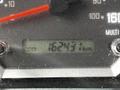 The image shows the odometer of a 2018 Isuzu NPR displaying a reading of 162431 kilometers