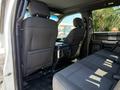 Interior view of a 2018 Ford F-150 showing the rear seats and center console in black fabric upholstery