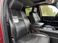 Interior view of a 2024 RAM 3500 featuring black leather seats with stitching and "Limited" badges on the headrests
