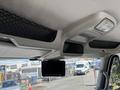 Interior view of a 2008 International DuraStar truck showcasing overhead storage and a digital display screen