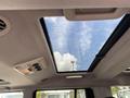 Interior view of a 2006 Land Rover LR3 showing the sunroof and overhead controls