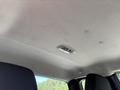 Interior ceiling view of a 2011 Chevrolet Colorado with a light fixture and fabric upholstery visible