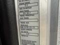 Label detailing specifications of a 2016 Peterbilt 348 truck including engine model and transmission information