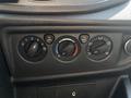 Controls for air conditioning and ventilation in a 2016 Ford Transit dashboard with knobs for fan speed temperature and airflow direction
