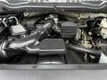 Engine compartment of a 2020 Ford F-350 SD showcasing the intake manifold and various engine components