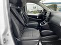 Interior view of a 2019 Mercedes-Benz Metris showing two front seats with seatbelts and the dashboard including steering wheel and center console