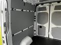 Interior of a 2022 Mercedes-Benz Sprinter van featuring gray paneling on the walls and a black flooring surface