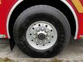 Close-up of a 2009 Spartan Gladiator wheel featuring a silver alloy rim and a Michelin tire clearly showing the tread pattern and size details