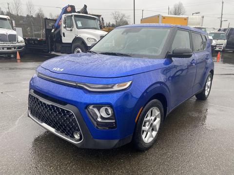 A blue 2022 Kia Soul with a distinctive front grille and modern design featuring LED headlights and a compact body style