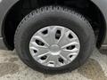 Close-up view of a wheel from a 2020 Ford Transit featuring a silver alloy rim and a black tire with tread patterns visible