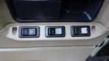Buttons on the interior panel of a 2003 International 5600i labeled with unlock lock right on and left