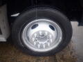 A close-up of a wheel and tire on a 2008 Ford F-550 showing a silver rim and a black tire with visible tread and lug nuts