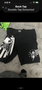 Black MMA shorts featuring the Tapout logo and design elements including stars and stripes on one side