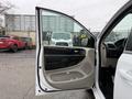 2017 Dodge Grand Caravan interior view with the driver's side door open showcasing the door panel and controls