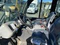Interior view of a 2015 Bobcat 5600 showing the driver's seat dashboard controls and levers