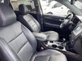 A 2015 Kia Sorento interior featuring black leather seats with a modern dashboard and center console