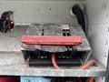 A metal switch labeled ON and OFF with visible wiring in a compartment of a 2000 Ford F-450