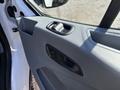 Interior door panel of a 2016 Ford Transit featuring a door handle and a window control switch
