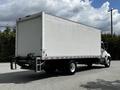 A white 2020 Hino 338 box truck with a rear cargo area and no visible branding or graphics