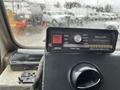 A Whelen Traffic Advisor control panel featuring buttons for power, function, and direction indicators with various light indicators displayed