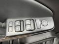 Close-up of the control panel on the driver's door of a 2016 Chevrolet Tahoe showing window and door lock buttons