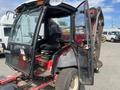 A 2014 Toro Groundmaster 5910 with a partially open cab featuring a black seat and control panel with various levers and gauges