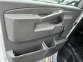 Interior door handle and storage compartment of a 2017 Chevrolet Express van