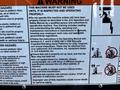 A warning label on a JLG 12SP aerial lift providing safety instructions and guidelines for operation and maintenance