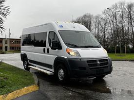 A white 2018 RAM Promaster van parked with a sleek design and large windows