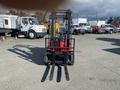 A red 2024 AGT KFE20 forklift with two long black forks positioned forward facing