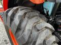 Close-up of a heavy-duty tire from a 2018 Kubota B2650 tractor showcasing its rugged tread pattern and textured surface