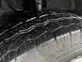 Close-up of a tire from a 2021 Ford Transit showing tread patterns and surface details